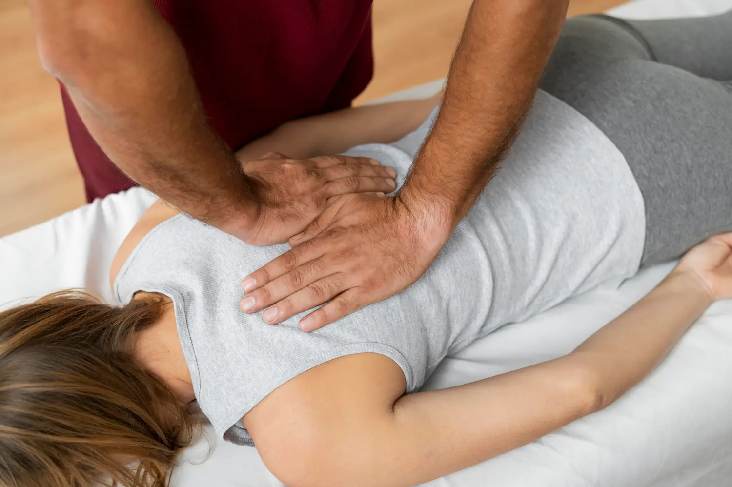 Chiropractor delivering a hands-on spinal adjustment