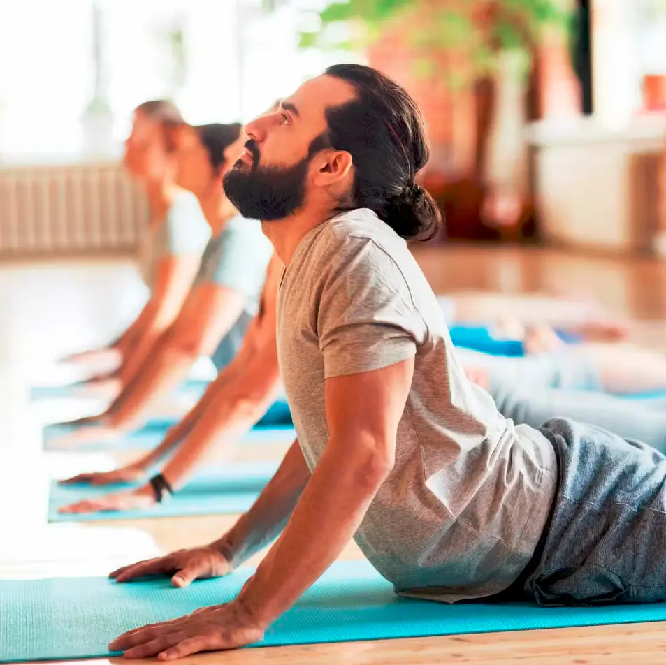 Patient performing a stretching exercise on a mat